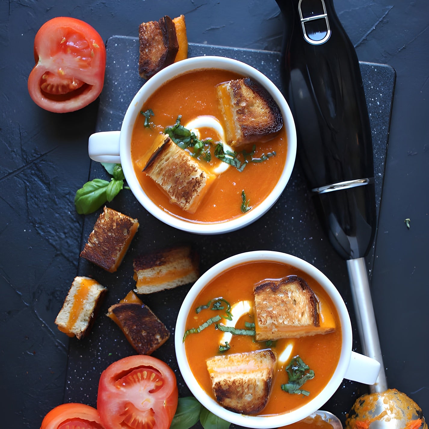 Hand blender blending hot soup in a pot – perfect for sauces and purees